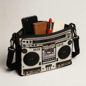 Cassette-style speaker handbag holding phone and wallet