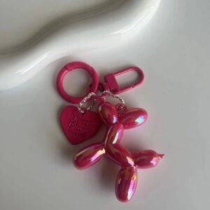 Shimmering fuchsia pup charm on keyring